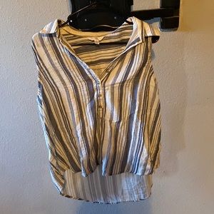 Stripped sleeveless top with buttons down the front.